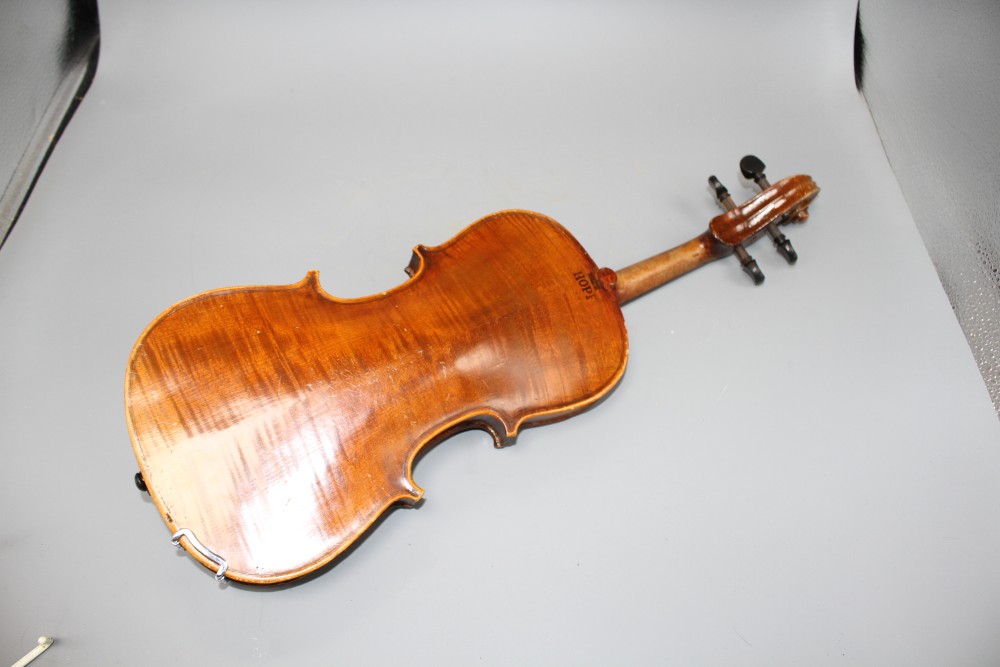 A violin with two piece back and bow, and a childs violin with bow, both with cases